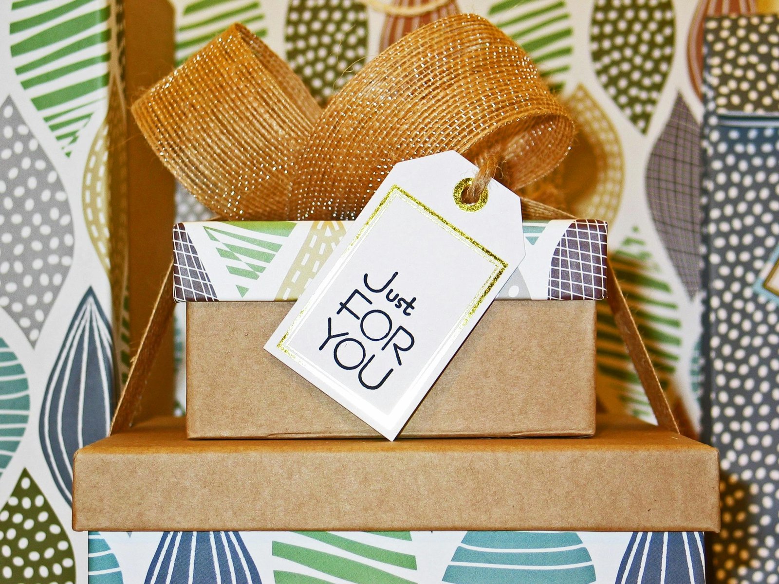 pexels-photo-264771-264771 A neatly wrapped gift box with decorative ribbon and 'Just For You' tag, perfect for celebrations.